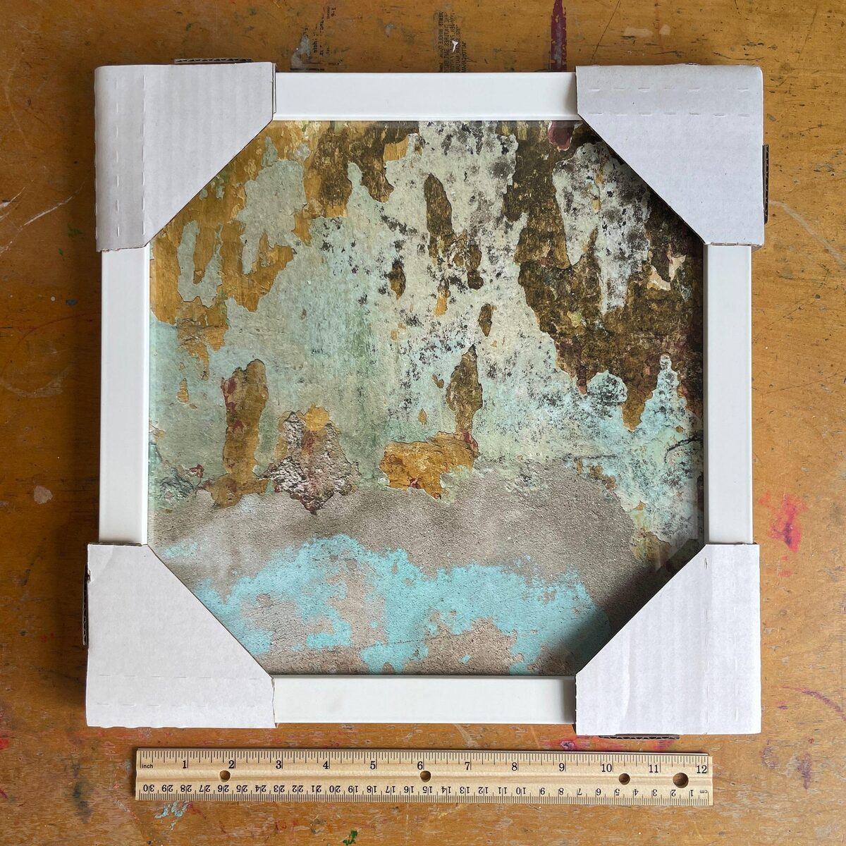 A photographed Mexican wall in a wooden frame